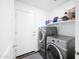 Laundry room with washer, dryer, and shelving at 961 W 20 Th St, Florence, AZ 85132