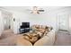 Relaxing living room with sectional sofa, large TV and ceiling fan at 961 W 20 Th St, Florence, AZ 85132