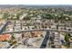 Aerial view of neighborhood, showcasing homes with solar panels at 9832 W Oraibi Dr, Peoria, AZ 85382