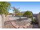 Spacious backyard with gravel landscaping and mature trees at 9832 W Oraibi Dr, Peoria, AZ 85382