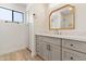 Elegant bathroom with gray cabinets and a quartz countertop at 9832 W Oraibi Dr, Peoria, AZ 85382