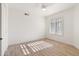 Bright bedroom featuring wood-look tile flooring and ceiling fan at 9832 W Oraibi Dr, Peoria, AZ 85382