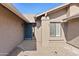 Front entry with a dark blue door and sidelights at 9832 W Oraibi Dr, Peoria, AZ 85382