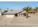 Single-story home with a two-car garage and desert landscaping at 9832 W Oraibi Dr, Peoria, AZ 85382