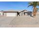 Single-story house with a two-car garage and desert landscaping at 9832 W Oraibi Dr, Peoria, AZ 85382