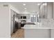 Modern kitchen with gray cabinets and quartz countertops at 9832 W Oraibi Dr, Peoria, AZ 85382