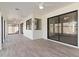 Sunroom with tile flooring and sliding glass doors at 9832 W Oraibi Dr, Peoria, AZ 85382