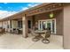 Spacious covered patio is perfect for relaxing or entertaining with a view to the landscaped backyard at 10971 W Tonopah Dr, Peoria, AZ 85373
