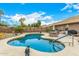Relaxing backyard features a refreshing pool, patio seating, and a well-maintained yard for outdoor enjoyment at 10971 W Tonopah Dr, Peoria, AZ 85373