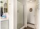 This bathroom features a stand-up shower with a glass door and an entrance into the main part of the bathroom at 10971 W Tonopah Dr, Peoria, AZ 85373