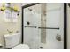 Bathroom features a shower with a glass door, vanity, mirror, sink, and toilet at 10971 W Tonopah Dr, Peoria, AZ 85373