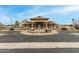 Well-maintained clubhouse featuring covered entryway, decorative stone, water feature, and dedicated parking at 10971 W Tonopah Dr, Peoria, AZ 85373