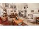 Spacious dining room with high ceilings, an elegant chandelier, and an open floor plan at 10971 W Tonopah Dr, Peoria, AZ 85373