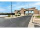 Community entrance, featuring lush landscaping and manicured grounds at 10971 W Tonopah Dr, Peoria, AZ 85373
