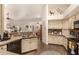 Well-lit kitchen with updated appliances, ample counter space, and wood-style floors at 10971 W Tonopah Dr, Peoria, AZ 85373