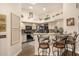 Modern kitchen featuring a breakfast bar, stainless steel appliances, and plenty of cabinet space at 10971 W Tonopah Dr, Peoria, AZ 85373