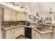 Bright kitchen with tile backsplash, modern appliances, and updated countertops at 10971 W Tonopah Dr, Peoria, AZ 85373