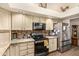 Well-equipped kitchen with stainless steel appliances, neutral countertops, and tiled backsplash at 10971 W Tonopah Dr, Peoria, AZ 85373