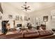 Inviting living room featuring a fireplace, comfortable seating, and French doors to the outdoors at 10971 W Tonopah Dr, Peoria, AZ 85373