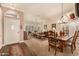 Cozy living room featuring neutral decor, plantation shutters, and a comfortable seating area at 10971 W Tonopah Dr, Peoria, AZ 85373