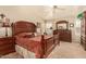 Spacious main bedroom with a ceiling fan, private outdoor access, and a large dresser at 10971 W Tonopah Dr, Peoria, AZ 85373