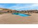 Community pool featuring comfortable lounge chairs and a spacious deck for relaxing and sunbathing at 10971 W Tonopah Dr, Peoria, AZ 85373