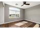 Spacious bedroom featuring a large window and wood flooring at 11332 E Des Moines Cir, Mesa, AZ 85207