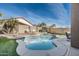 Relaxing swimming pool with artificial turf and a water feature at 11332 E Des Moines Cir, Mesa, AZ 85207