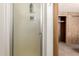 Shower stall with frosted glass door in a small bathroom at 11411 N 91 Ave # 56, Peoria, AZ 85345