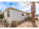 Single-wide manufactured home with carport and palm trees at 11411 N 91 Ave # 56, Peoria, AZ 85345