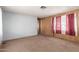 Carpeted living room with wood paneled walls at 11411 N 91 Ave # 56, Peoria, AZ 85345