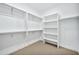 Spacious walk-in closet with built-in shelving and ample storage space at 12 E Northview Ave, Phoenix, AZ 85020