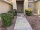 Front entry with a stone path and well-maintained landscaping at 13015 W Caraway Dr, Sun City West, AZ 85375