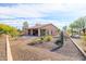 View of backyard with desert landscaping and a covered patio at 13050 W Pinnacle Vista Dr, Peoria, AZ 85383