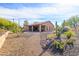 Landscaped backyard with desert plants and a patio area at 13050 W Pinnacle Vista Dr, Peoria, AZ 85383