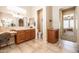 Spacious bathroom with double sinks, and a view of a bedroom at 13050 W Pinnacle Vista Dr, Peoria, AZ 85383