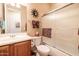 Bathroom with shower/tub combo, wood cabinets, and tiled floor at 13050 W Pinnacle Vista Dr, Peoria, AZ 85383