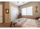 Bedroom with double door closet, ceiling fan, and window blinds at 13050 W Pinnacle Vista Dr, Peoria, AZ 85383
