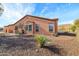 Tan house exterior with desert landscaping at 13050 W Pinnacle Vista Dr, Peoria, AZ 85383