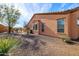 Tan house exterior with desert landscaping and walkway at 13050 W Pinnacle Vista Dr, Peoria, AZ 85383