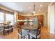 Island kitchen with seating, stainless steel appliances, and granite counters at 13050 W Pinnacle Vista Dr, Peoria, AZ 85383