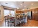 Open concept kitchen with breakfast bar and ample cabinet space at 13050 W Pinnacle Vista Dr, Peoria, AZ 85383