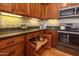 Modern kitchen with dark countertops and stainless steel appliances at 13050 W Pinnacle Vista Dr, Peoria, AZ 85383