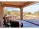 Covered patio with seating area and mountain views at 13050 W Pinnacle Vista Dr, Peoria, AZ 85383