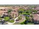Aerial view of the neighborhood showcasing beautiful homes and lush greenery at 14250 W Wigwam Blvd # 2822, Litchfield Park, AZ 85340