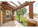 View from the balcony framed by a pergola, with an iron railing and nearby foliage at 14250 W Wigwam Blvd # 2822, Litchfield Park, AZ 85340