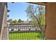 Balcony featuring lush greenery, wrought iron railing, and neighborhood views at 14250 W Wigwam Blvd # 2822, Litchfield Park, AZ 85340