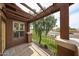Cozy balcony with wood pergola offering serene views of the grassy street at 14250 W Wigwam Blvd # 2822, Litchfield Park, AZ 85340