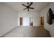 Open bedroom featuring carpet floors, ceiling fan, and easy access to the walk-in closet at 14250 W Wigwam Blvd # 2822, Litchfield Park, AZ 85340