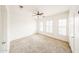Spacious bedroom featuring neutral carpet and shuttered windows at 14250 W Wigwam Blvd # 2822, Litchfield Park, AZ 85340